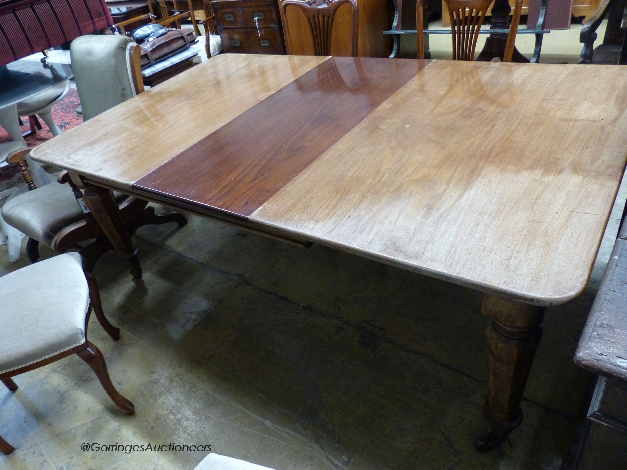 A mid Victorian mahogany extending dining table, 184cm extended with one spare leaf, width 109cm, height 71cm